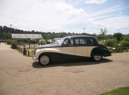 Classic ivory and black wedding car in Slough